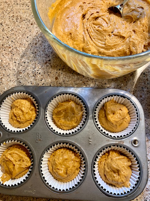 pumpkin muffin mixture in tins