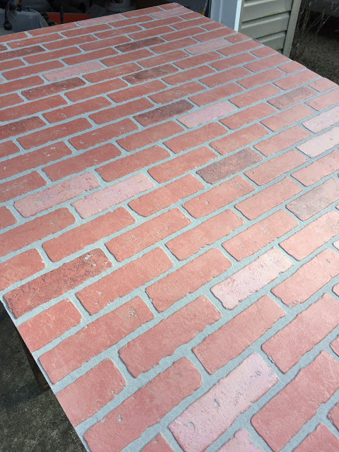 using faux brick wallboard to create a backsplash for our cottage kitchen