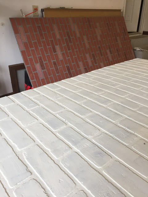 faux brick wallboard painted white for a kitchen backsplash