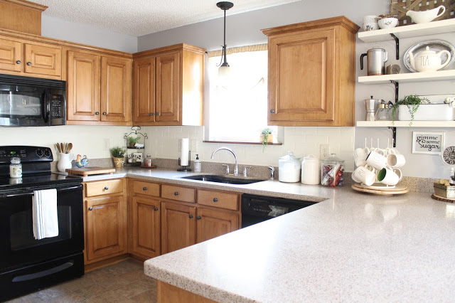 DIY painted faux brick backsplash in a cottage kitchen