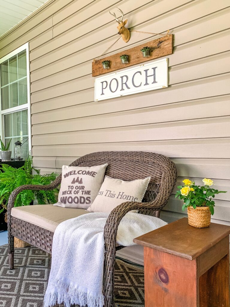 Seating area featuring a wicker love seat from Home Depot, home depot wicker furniture, home depot loveseat, wicker furniture, porch decor