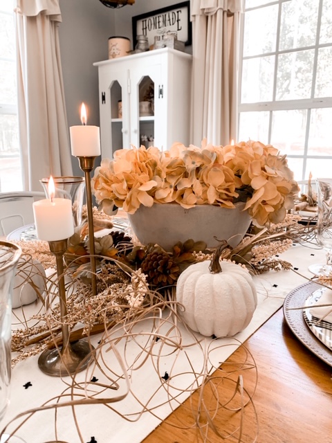 diy concrete bowl with cream colored hydrangeas for a neutral flal table