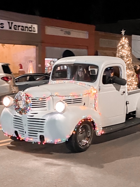 vintage pickup truck in mistletoe madness Christmas parade