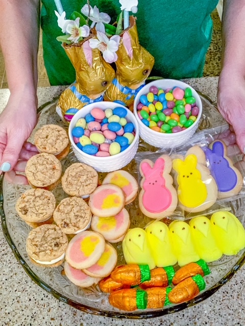 An Easter dessert tray using chocolate bunnies, jelly beans, and marshmallow peeps