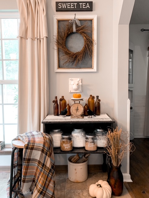 A farmhouse style kitchen baking station decorated for the fall season