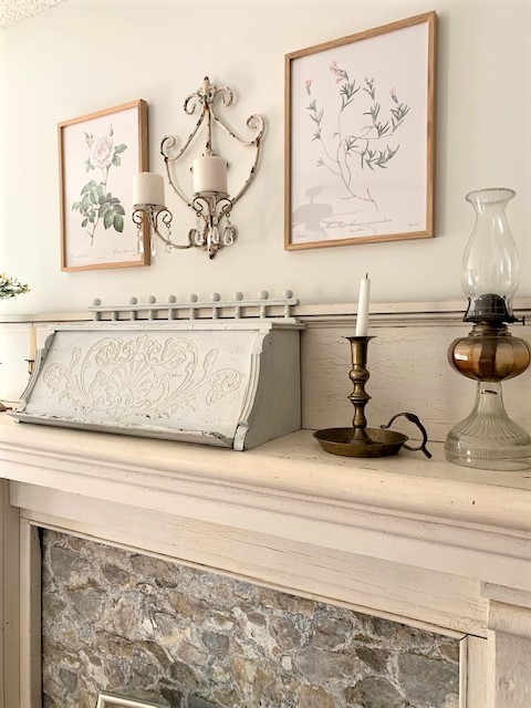 vintage inspired decor on an antique mantel