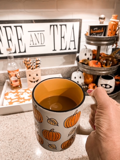 coffee bar styled for fall with a Halloween themed tier tray