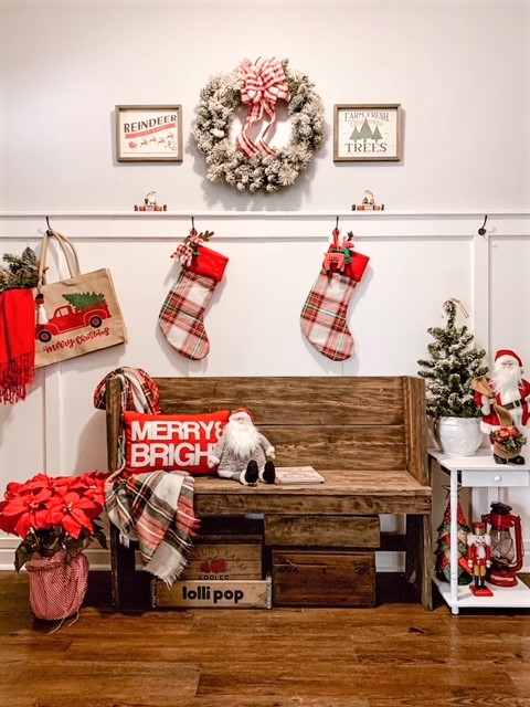 A front foyer decorated for Christmas with a diy board and batten treatment