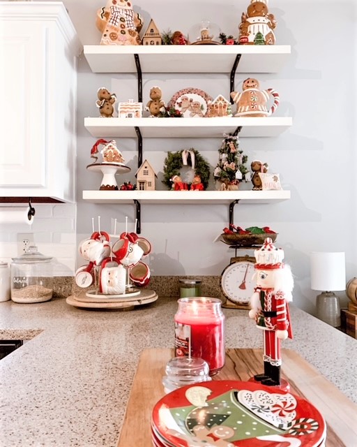 Gingerbread collection Christmas decor dispayed on kitchen open shelving