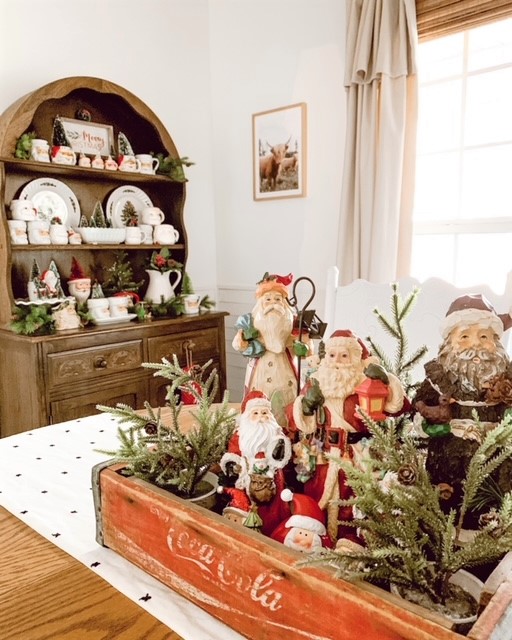 Santas in a box displayed as Christmas table centerpiece