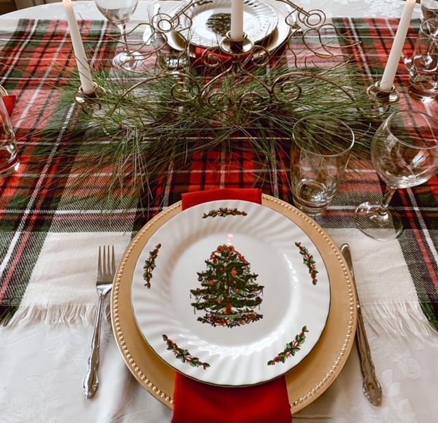 A simple Christmas table setting styled with items on hand and fresh pine 