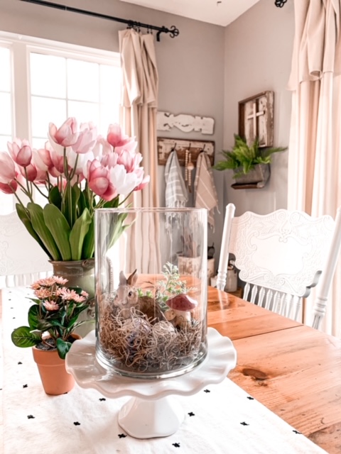 spring table vignette made with plants and a bunny