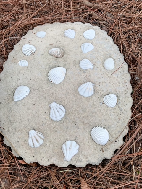 diy stepping stone decorated with sea shells