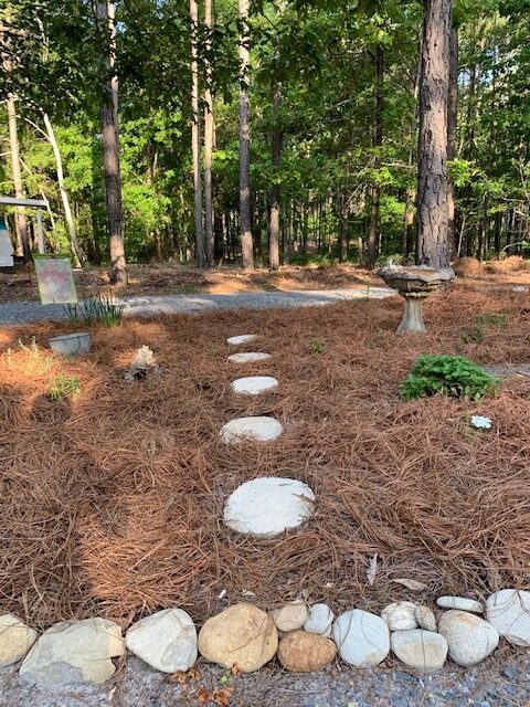 flower garden decorated with diy concrete stepping stones