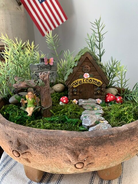 fairy garden in an old terra cotta planter