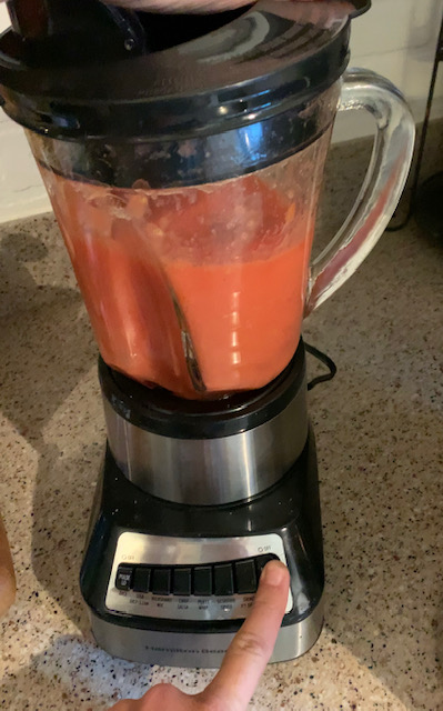 pulse peeled tomatoes in blender to liquify 