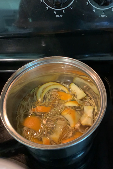 simmering ingredients for honeysuckle simple syrup