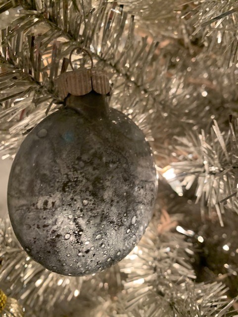 mercury glass ornament on tinsel tree