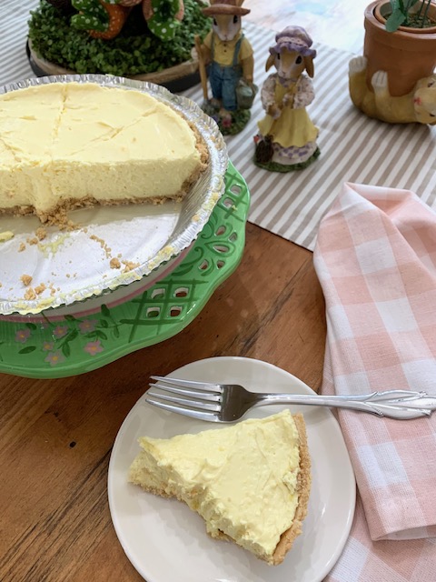 a slice of lemon pie on a plate ready to enjoy