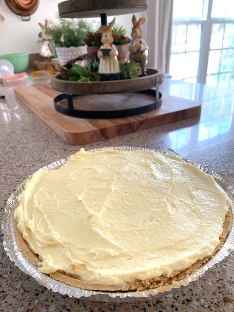 a delicious cream cheese lemonade pie sitting on a wood table