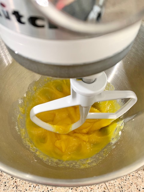 mixing evaporated milk and lemon pudding mix for a pie