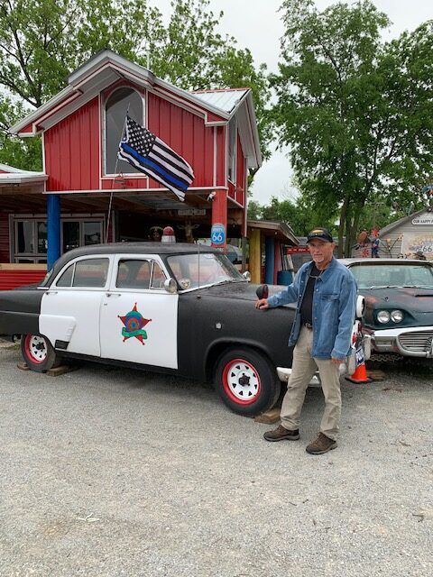 tourist attraction with a vintage police car on Route 66