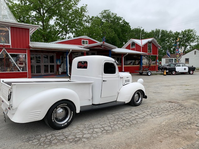 a 1946 Dodge pickup sitting along the Route 66 highway
