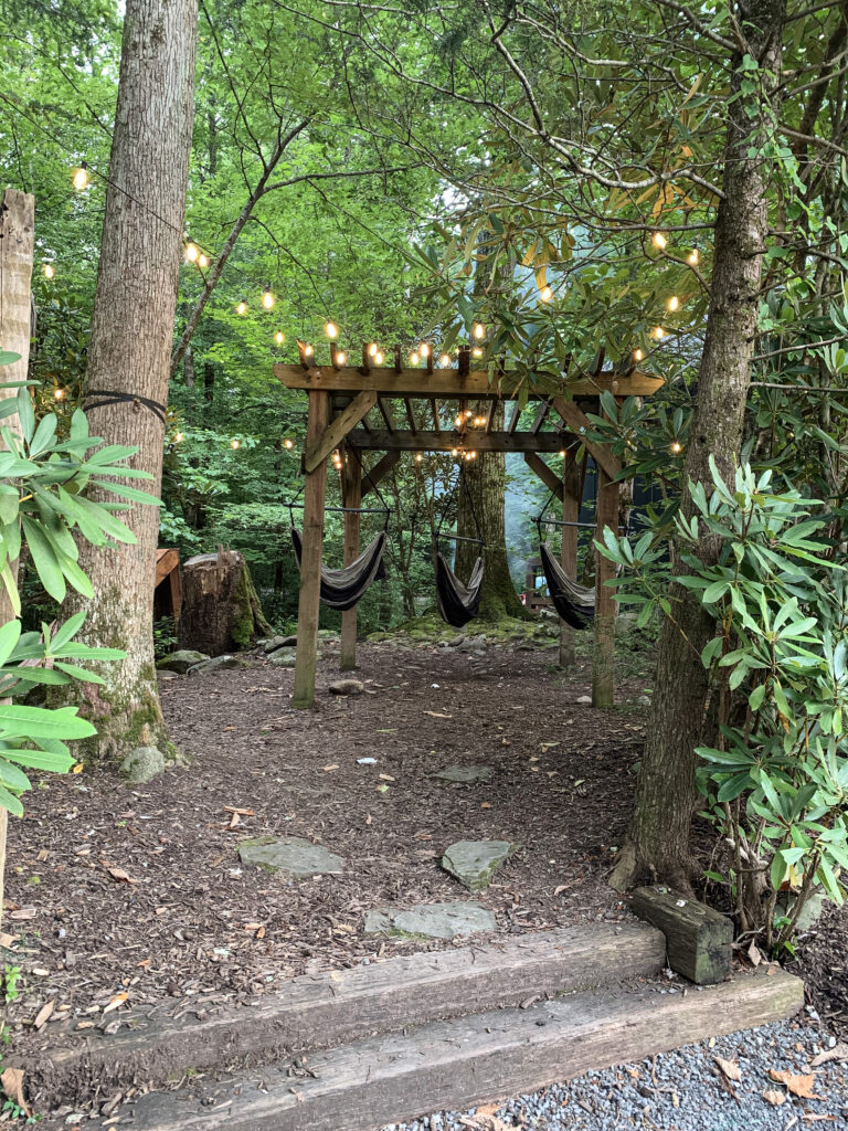 an enchanted area of Roamstead campground where hammocks provide a place to rest 