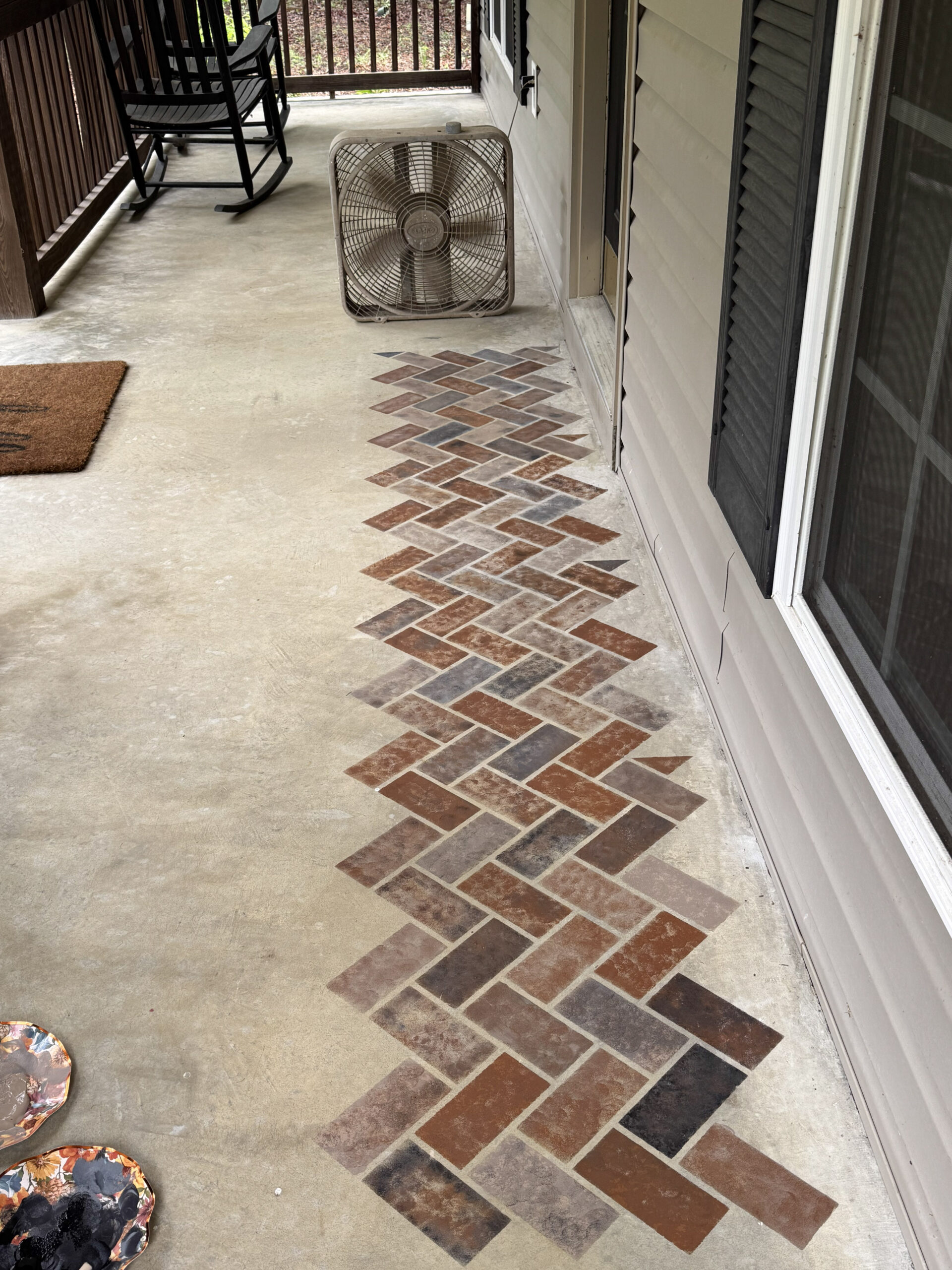 stenciling faux bricks on a concrete porch floor
